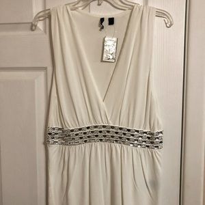 Sleeveless knit top. With beaded waist